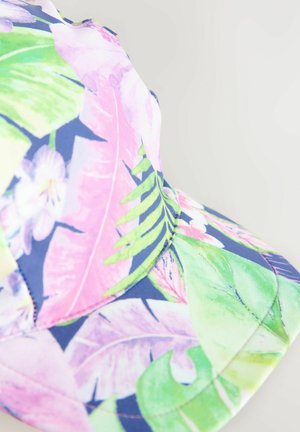 Colorful cap featuring a floral pattern with pink leaves and green accents on a navy background, made from soft fabric with visible stitching.