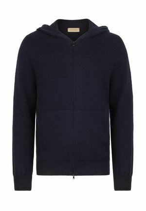 Marinblå zip-up huvtröja i mjukt tyg, med en framficka och ribbade ärmslut. Designen inkluderar en huva och en ren, minimalistisk stil.