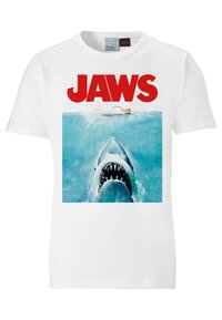 White cotton t-shirt featuring a graphic print of a shark and swimmer, with the word "JAWS" in bold red above the image.
