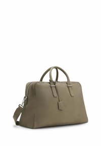 Olive green leather handbag with dual handles, a detachable shoulder strap, and metal hardware accents. Features a textured surface and zip closure.