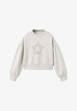 Svijetlosiva skraćena trenirka s dugim, napuhanih rukavima i zvjezdanim uzorkom od malih rupica u središtu. Glatka tekstura i rebrasti manžeti.