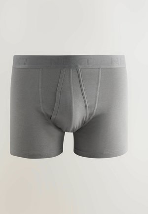 Graue Baumwoll-Boxershorts mit weicher Textur, ausgestattet mit einem elastischen Bund mit Logo und einem Frontbeutel mit konturiertem Design.