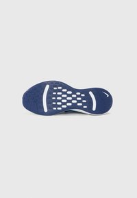 Blue athletic shoe outsole with a textured rubber surface, featuring a grid pattern for grip, and a white accent along the midsole.