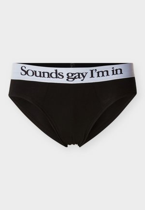 Μαύρα βαμβακερά σλιπ με λευκή ελαστική μέση που φέρει το κείμενο "Sounds gay I'm in" με μαύρα γράμματα. Ομαλή υφή, κλασικός σχεδιασμός.