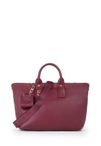 Sac en cuir bordeaux avec deux poignées, une sangle amovible, des finitions en doré, et une petite étiquette avec la mention "JE SUIS UN SAC RESPONSABLE."