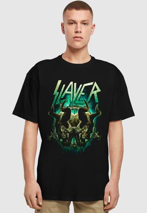Black cotton t-shirt featuring a graphic design with a skull and horns in green and white, plus the word "SLAYER" in bold, stylized letters.
