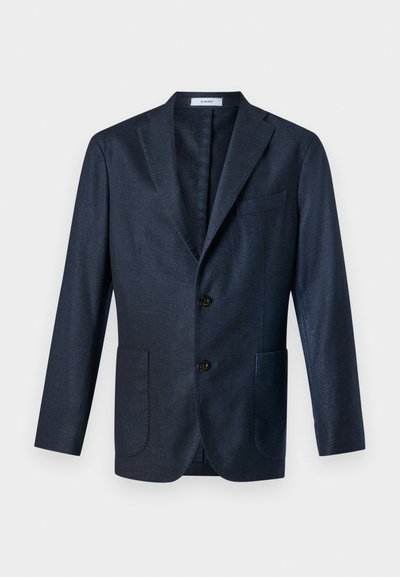 Navy blue blazer made of textured fabric, featuring two front pockets, a notched lapel, and two buttons. Interior lined.
