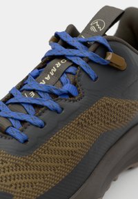 Sneaker with a gray synthetic upper, textured brown accents, and blue laces. Features a streamlined shape and a reinforced toe.