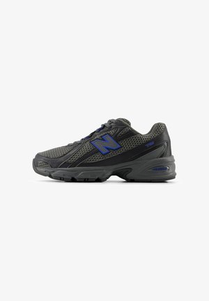 Gray mesh running shoe with black synthetic accents, featuring a prominent blue "N" logo, padded collar, and textured sole for traction.