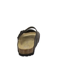 Brown leather slip-on sandal with adjustable strap, cork midsole, and textured black rubber sole. Features a soft footbed for comfort.