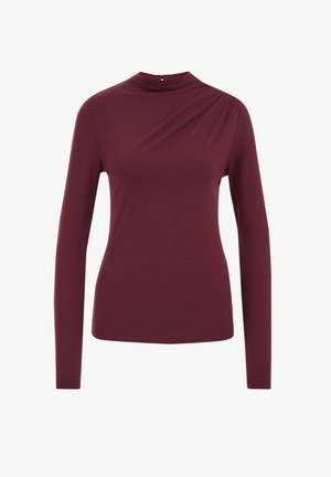 Burgundia pikkade varrukatega topp kõrge kaelusega ja vasaku õla pehme drapeeringuga, valmistatud pehmest ja venivast kangast. Sile tekstuur ja keha lähedane disain.