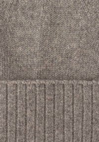 Gray knitted beanie with a ribbed brim, featuring a textured pattern and a flecked design that includes lighter and darker threads.