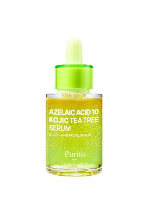 Bottiglia contagocce in vetro trasparente con tappo verde contenente siero giallo, etichettata Azelaic Acid 10 Kojic Tea Tree Clarifying Facial Serum di Purito.