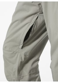 Lichtgrijze broek met een zijzak met een netvoering, gemaakt van een soepele, flexibele stof. Zichtbare stiksels en een getailleerde pasvorm.