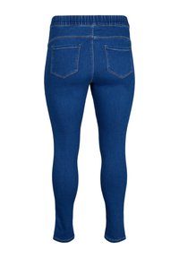 Blue denim leggings with a stretchy waistband. Features two back pockets and a smooth, form-fitting design. No front pockets visible.