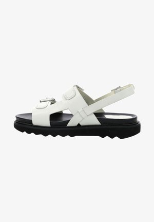 Witte lederen sandalen met verstelbare banden, een zwarte rubberen zool en een zigzagprofiel. Voorzien van zilveren hardwareaccenten.
