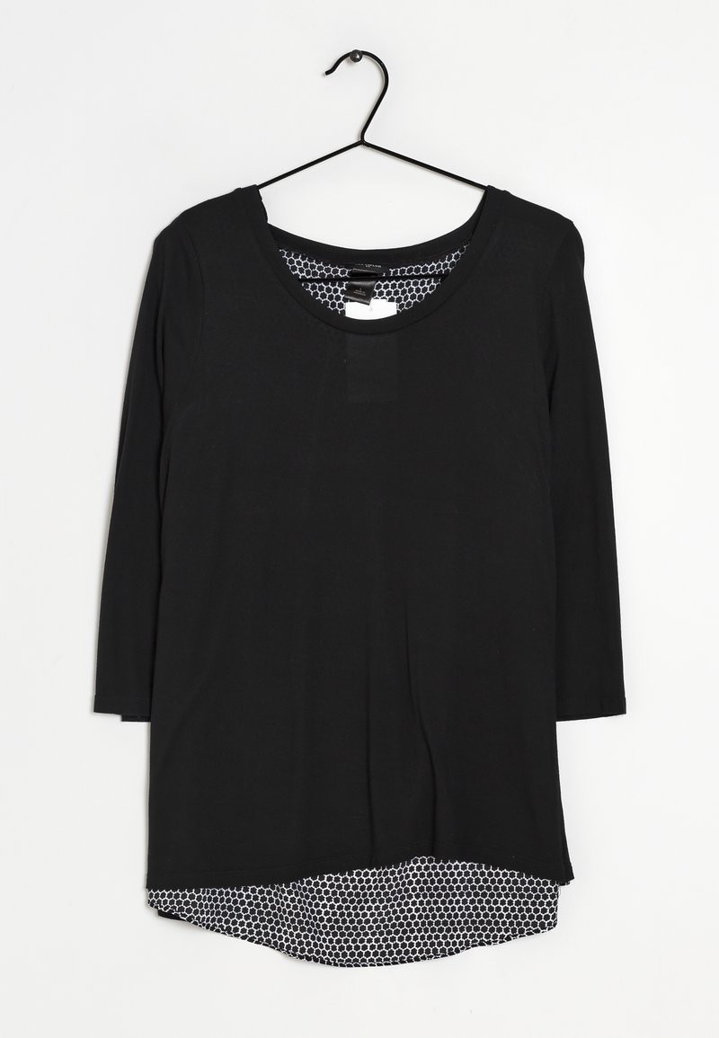 Maglietta nera a maniche lunghe con scollo rotondo, caratterizzata da uno strato interno a motivo esagonale bianco contrastante all'orlo. Tessuto dalla texture liscia.