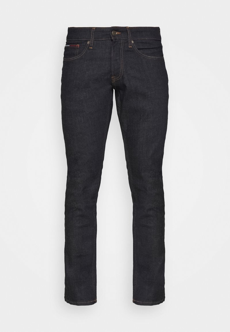 Donkerblauwe denim jeans met een slim fit, voorzien van vijf zakken, een ritszoom en contrasterende stiksels. De stof heeft een gladde textuur.
