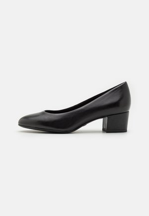 Black leather block-heeled pump with a pointed toe, smooth texture, and low heel design, featuring a curved collar and simple silhouette.