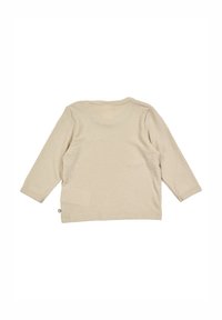 Krémový top s dlouhým rukávem, ribbovanou texturou, kulatým výstřihem a prošívanými detaily na manžetách a spodním lemu. Zobrazeno ze zadní strany.