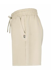 Beige Shorts aus weichem Stoff mit elastischem Bund, Kordelzug, Seitentaschen und einem kleinen Markenetikett an der Seite.