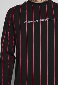 Kings Will Dream Long sleeved top - black