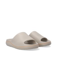 Beige slide sandals made of soft material, featuring an open toe design, curved upper, and a contrasting orange stripe along the sole.