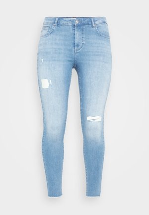 Blugi skinny de culoare albastru deschis, realizați din denim, cu detalii distorsionate și petice rupte pe ambele picioare, având un design standard cu cinci buzunare.