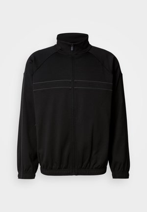 Black zip-up jacket made of soft fabric, featuring a high collar, elastic cuffs, and decorative horizontal stripes across the chest.