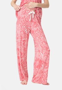 Lätta, korallfärgade pyjamasbyxor med ett vitt blommönster, elastisk midja med dragsko och vida ben. Mjuk textur.