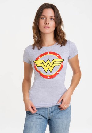 Gray short-sleeve t-shirt featuring a large yellow Wonder Woman logo circled by red with white stars, made of soft, stretchy material.
