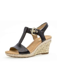 Sandali con zeppa in pelle nera, design a T-strap, con tacco intrecciato e testurizzato e una fibbia dorata per una chiusura sicura.