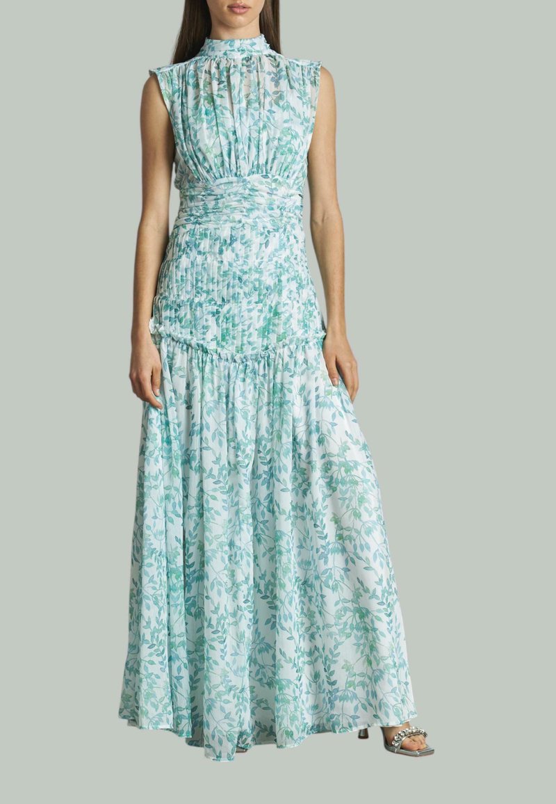 Maxikleid aus leichtblauem Stoff mit grünem Blumenmuster. Verfügt über einen hohen Ausschnitt, ein plissiertes Oberteil und einen gerafften Rock. Ärmelloses Design.