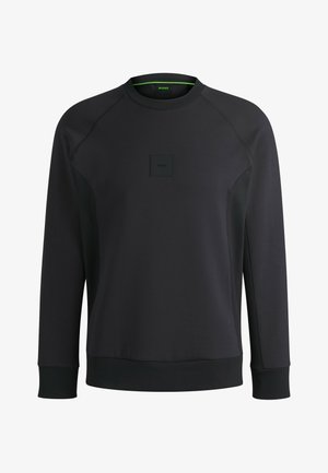Schwarzer Pullover aus weichem Material, mit Rundhalsausschnitt, Raglanärmeln und einem strukturierten Patch mit Logo auf der Vorderseite.