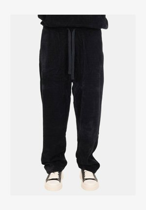 Pantaloni della tuta neri in corduroy con vita elastica e lacci regolabili, caratterizzati da una vestibilità comoda e una consistenza morbida.
