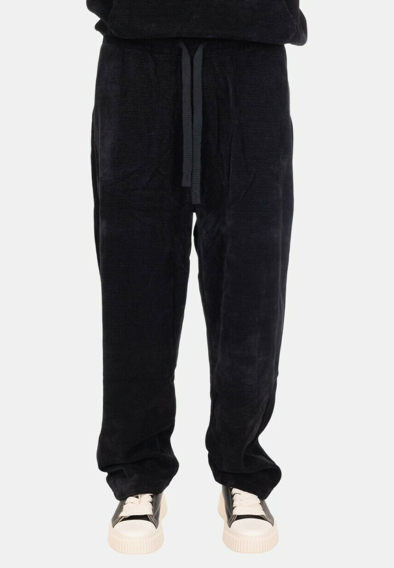 Pantaloni della tuta neri in corduroy con vita elastica e lacci regolabili, caratterizzati da una vestibilità comoda e una consistenza morbida.