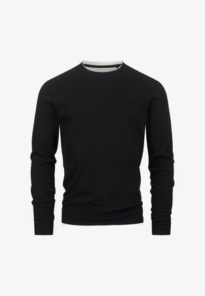 Chemise noire à manches longues côtelées avec un col rond, comportant un col intérieur blanc contrastant et un petit logo sur la poitrine.