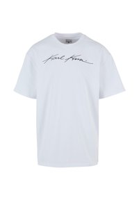 T-shirt en coton blanc à manches courtes, avec un logo en cursive noir à l'avant. Design ras du cou, coupe décontractée, texture lisse.