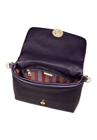 Purple leather handbag with gold hardware. The interior features striped fabric in gray, pink, and brown. Flush magnetic snap closure.