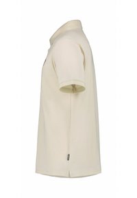 Heren polo met korte mouwen in licht beige katoen. Heeft een rechte snit, zachte textuur en een klein logo op de borst.