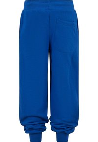Pantalons de survêtement en coton bleu avec une taille côtelée, des poignets élastiques, des poches latérales et une poche arrière unique. Texture lisse avec une coupe décontractée.