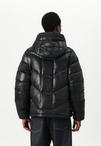 Helly Hansen VILLAGE UNISEX - Daunenjacke - black