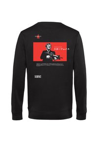 Černá mikina s výraznou červenou grafikou, na které je postava držící zbraň a japonský text. Logo "Scarface" ve spodní části.