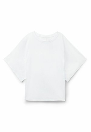 T-shirt bianca oversize a maniche corte con collo a giro, mostrata piatta su sfondo bianco.