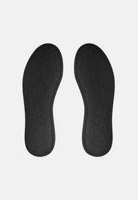 Black insoles featuring a textured surface with a diamond pattern, designed for comfort and support, with contoured edges for a snug fit.