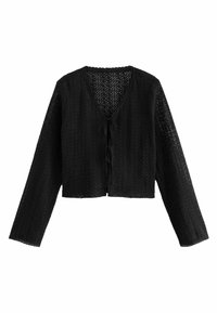 Czarny, krótki kardigan z długimi rękawami, z teksturowanym, otwartym koronkowym wzorem oraz dekoltem w kształcie litery V. Zawiązywany z przodu na węzeł.