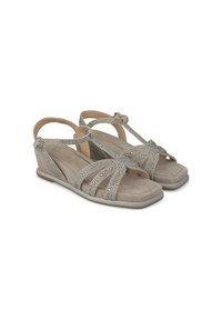 Sandali con tacco a cuneo beige con fasce glitterate e una tomaia morbida e testurizzata. Design open-toe, cinturino alla caviglia regolabile e suola in gomma piatta.