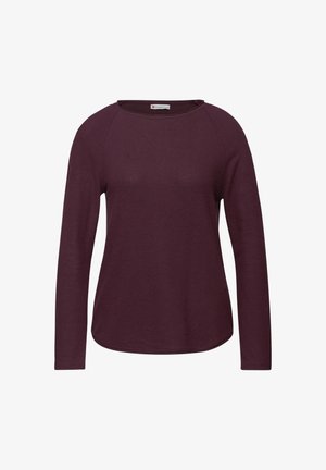 Camisa de pulóver de manga larga en púrpura oscuro, hecha de una tela suave. Presenta un escote circular y mangas raglán, con un dobladillo curvado.
