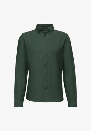 Chemise à manches longues vert foncé avec un col boutonné, des boutons à l'avant et une texture de tissu lisse. Présente des poignets ajustés et une coupe cintrée.