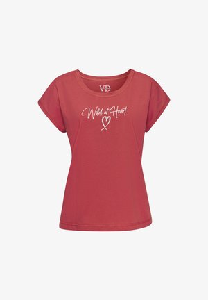 Kokvilnas T-krekls rūsas krāsā ar īsām piedurknēm, apaļu kakla izgriezumu, ar baltu uzrakstu "Wild at Heart" un sirds grafiku uz priekšpuses.